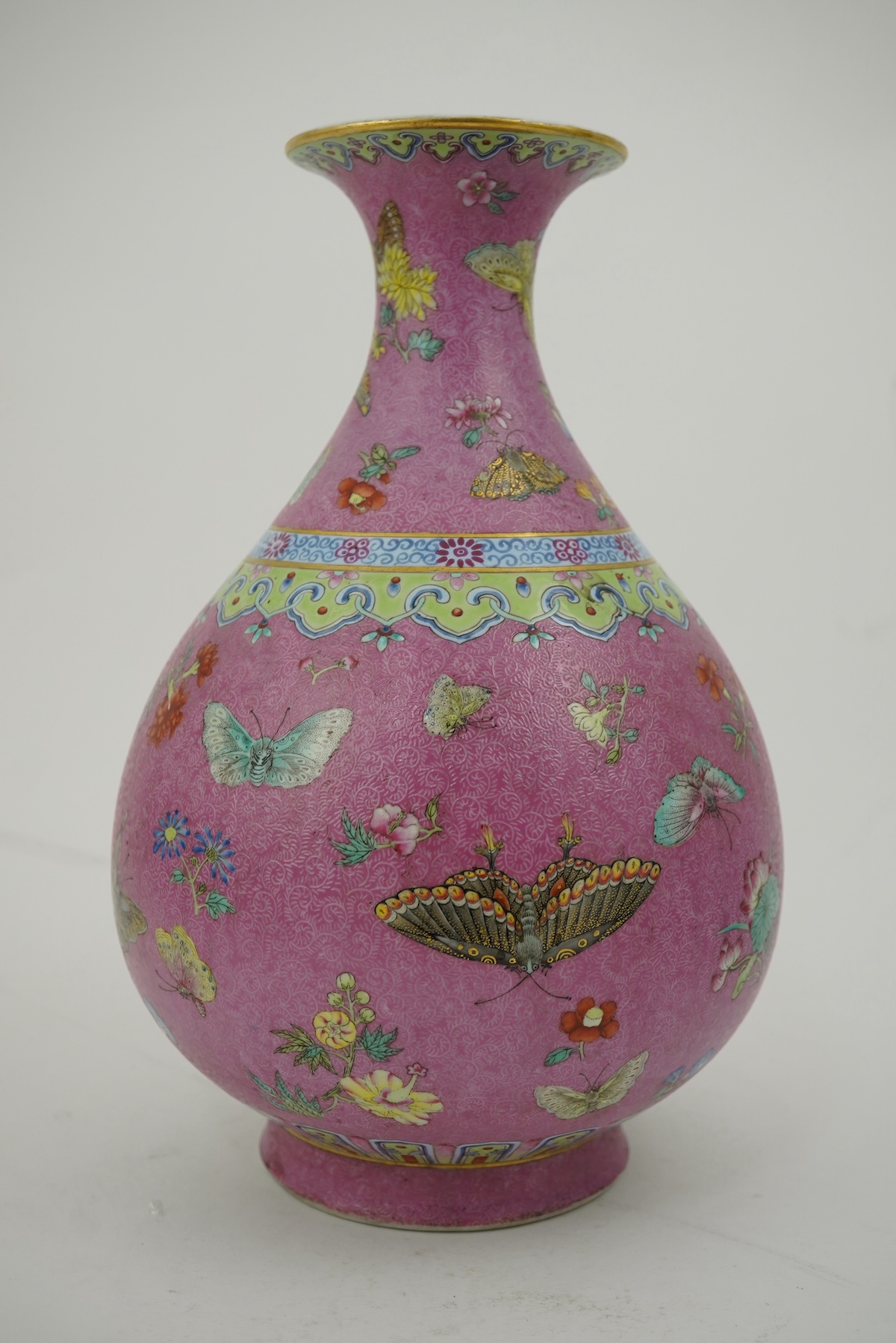 A Chinese pink-ground sgraffito pear-shaped vase, yuhuchunping, Daoguang six character seal mark and of the period (1821-50)